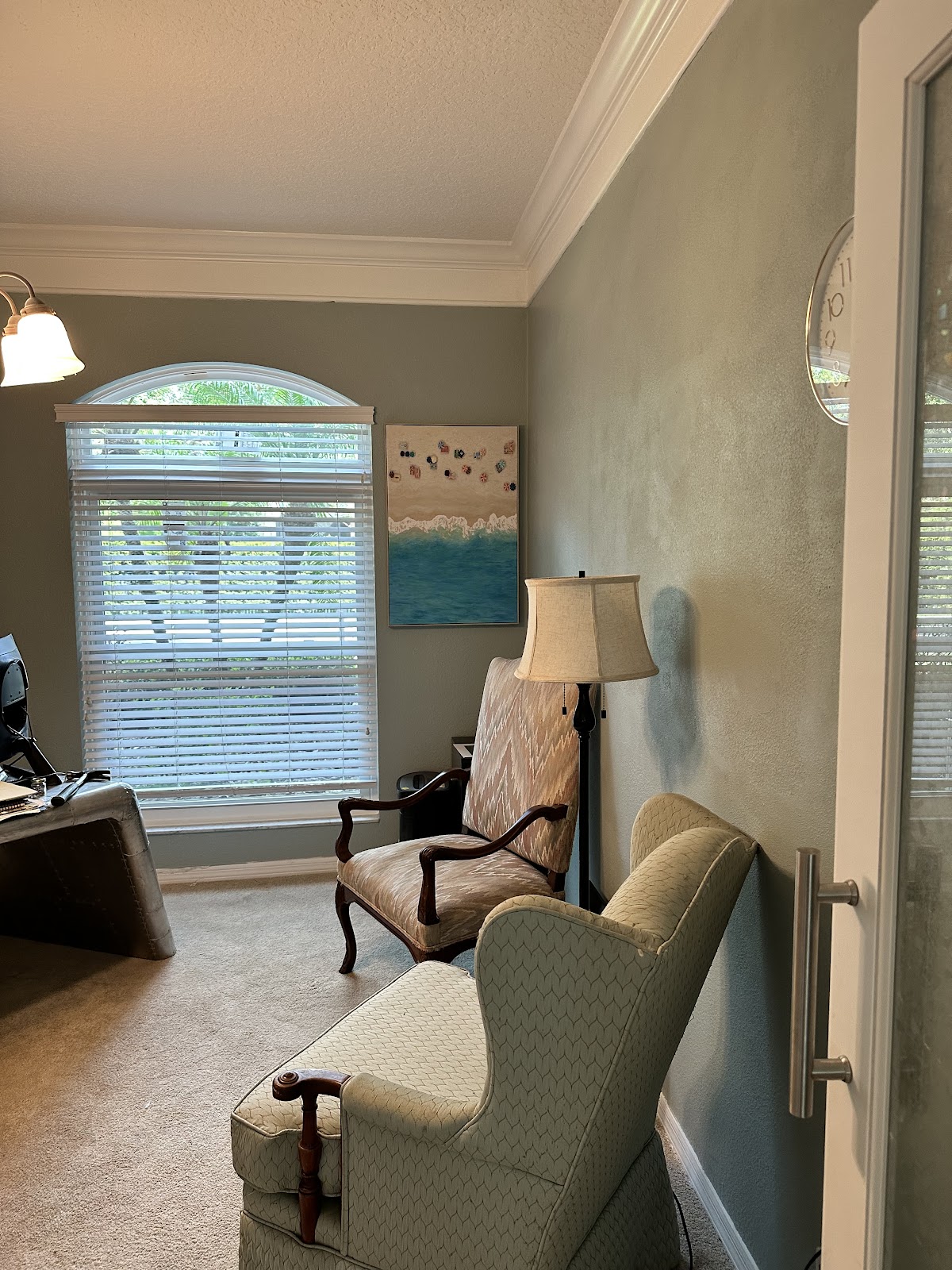 Living room with crown molding and fresh paint